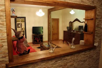a person taking a picture of a mirror in a living room at Casa do Bouza Vello in Sober