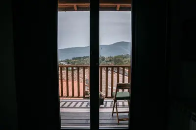 a view out of a window of a balcony at O balcón da ribeira in Parada del Sil