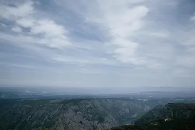 a view of a valley from the top of a mountain at O balcón da ribeira in Parada del Sil