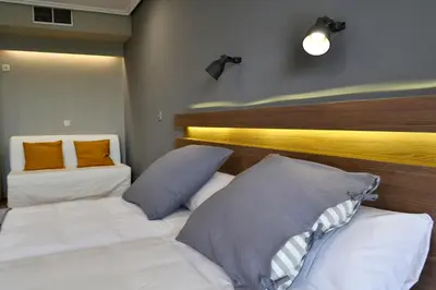 a bedroom with two beds and two pillows at Hotel Alda Sada Marina in Sada