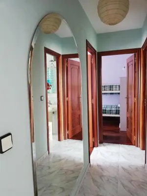 a mirror in the hallway of a house at Apartamento Santa Marta in Santiago de Compostela