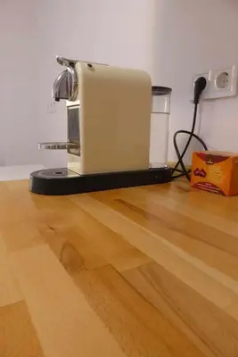 a toaster sitting on top of a wooden floor at RyS Ourense Centro PARKING Gratis in Ourense