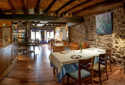 a bedroom with two beds in a room at Micro-Hostal La Puerta del Perdón in Villafranca del Bierzo