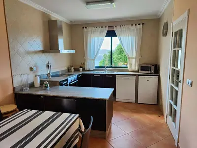 a kitchen with a sink and a counter top at Alojamientos Viveiro - El Escairo in Viveiro