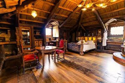 a bedroom with a bed and a table and chairs at Prada a Tope - Palacio de Canedo in Canedo