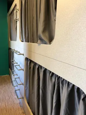 a room with a bed with curtains on it at Andaina in Sarria