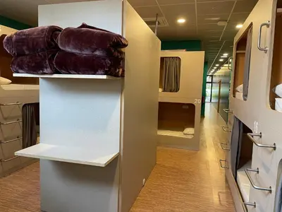 a walk in closet with a row of brown bags at Andaina in Sarria