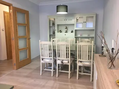 a dining room with a glass table and four chairs at CALLE HUERTAS Nº 17 - 1º in Lugo