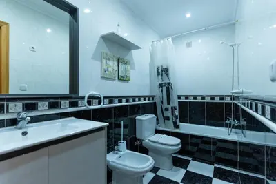 a bathroom with a sink and a toilet and a tub at Puente Romana in San Ciprián