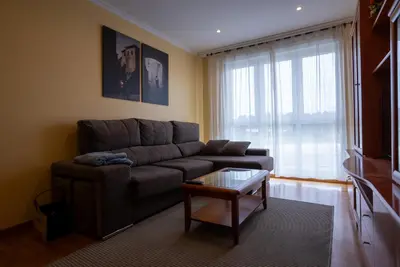 a living room with a couch and a coffee table at Puente Romana in San Ciprián