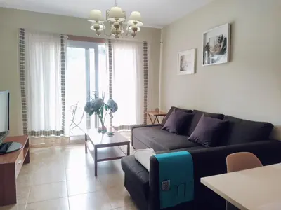 a living room with a couch and a table at A&L Playa in Viveiro