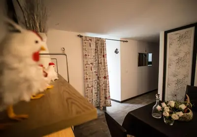 a room with a table with a toy duck on it at Casa de Abaixo in Rinlo