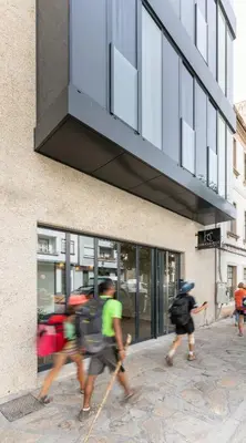 a group of people walking in front of a building at Hotel Concheiros in Santiago de Compostela