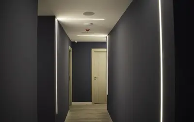 a hallway with black walls and a white door at Santa Filomena in Santiago de Compostela