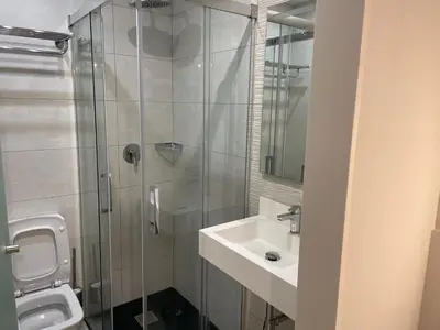 a bathroom with a shower and a sink and a toilet at Santa Filomena in Santiago de Compostela