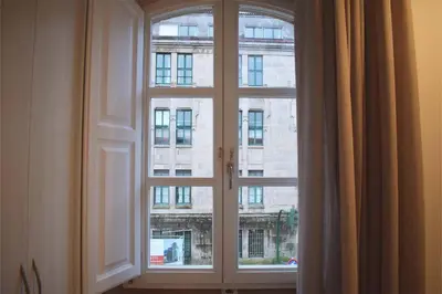 a window with a view of a building at Santa Filomena in Santiago de Compostela