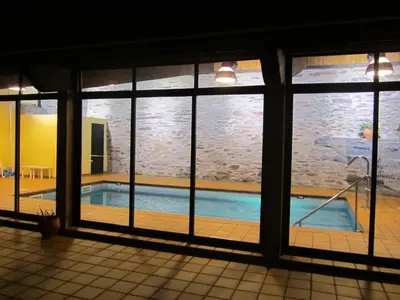 a swimming pool seen through a window at Casa Grande da Ferreria de Rugando in Rugando