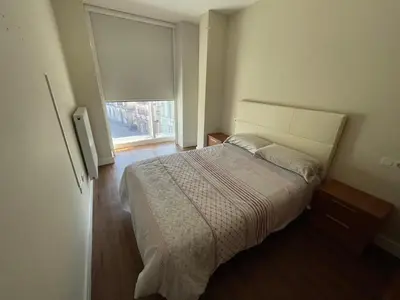 a bedroom with a large bed and a window at Lugo 360 in Lugo