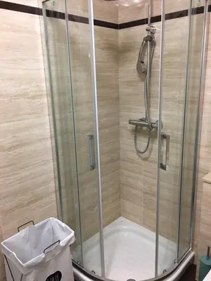 a shower with a glass door in a bathroom at Lugo 360 in Lugo