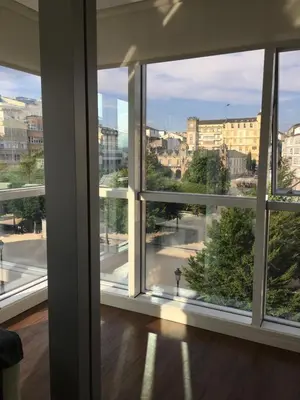 an open window with a view of a city at Lugo 360 in Lugo