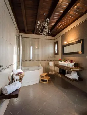 a large bathroom with a tub and a sink at Casa Ramiras in O Viso