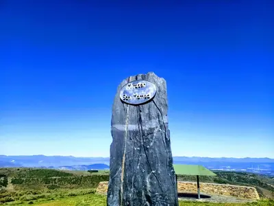 a stone pillar with a sign on top of a hill at Casa Rural del Acebo in Espinoso de Compludo