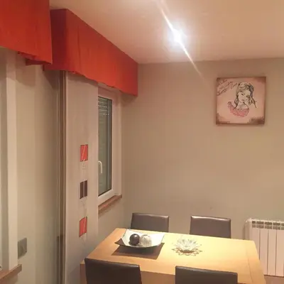 a dining room with a table and chairs at Bierzo centro in Ponferrada