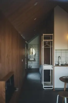 a room with a kitchen with a ladder in it at MU_MORADAS NO ULLA in Teo
