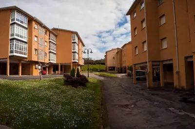 an empty street in a city with tall buildings at SAN CIPRIAN 