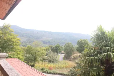 a view of a valley from a roof of a house at Casa Spa en montaña in Pontevedra