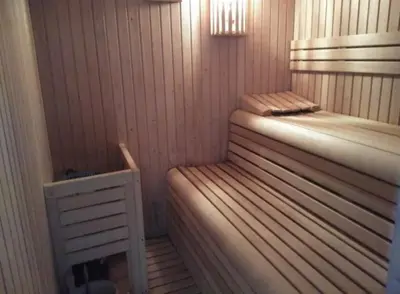 a sauna with a bed and a table in it at Casa Spa en montaña in Pontevedra