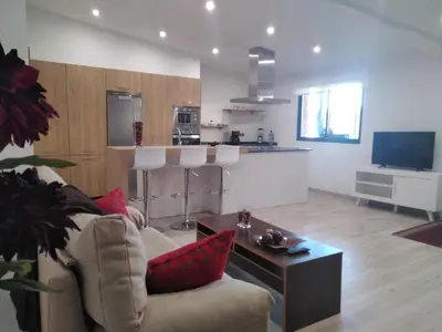 a living room with a couch and a table at Casa Spa en montaña in Pontevedra