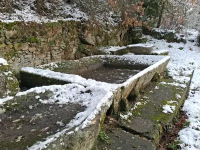 three stone steps covered in snow with snow on them at A Brava in Sas de Penelas