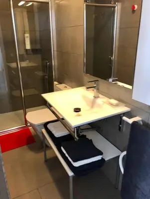a bathroom with a sink and a shower at La Casa de Antón in Tineo