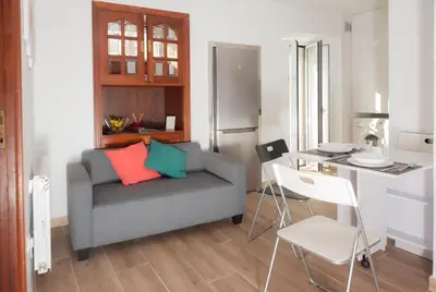 a living room with a couch and a table at Apartamento Algalia Catedral in Santiago de Compostela