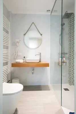 a bathroom with a toilet and a sink and a shower at Pension ARCA in O Pedrouzo