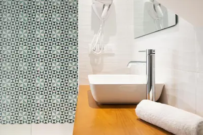 a bathroom with a sink and a shower at Pension ARCA in O Pedrouzo