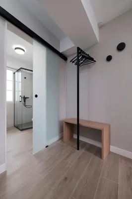 a room with a walkin closet and a bench in it at PR 25 de Julio in Santiago de Compostela