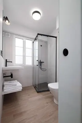 a bathroom with a shower and a toilet and a sink at PR 25 de Julio in Santiago de Compostela