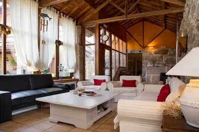 a living room with a couch and a table at Casa de Turismo Rural Sabariz in Sabariz