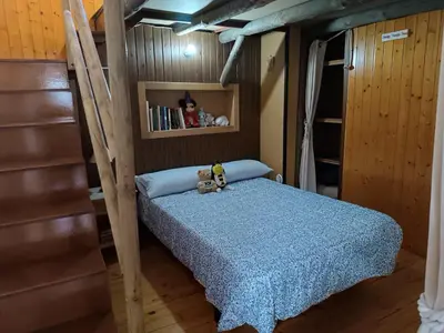 a bedroom with a bunk bed with two teddy bears on it at La Casa de las Rocas - En la Ribeira Sacra in Nogueira de Ramuin