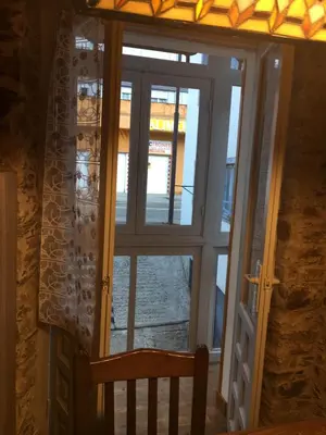 a door to a room with a window at Narcea Turismo Real in Cangas del Narcea