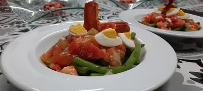a white bowl of food on a table at Rectoral de Anllo in Sober