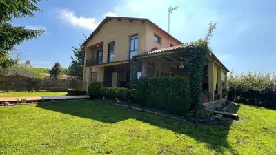 a house with a green yard in front of it at Twin Pines Camino Norte in Arzúa