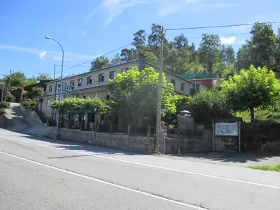 a building on the side of a street at Hotel Chola in Dorna