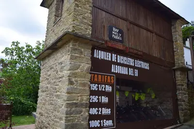 a store with signs on the side of a building at Alborada del Eo in Vegadeo