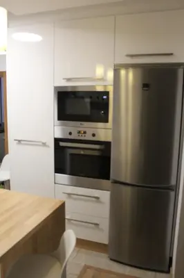a kitchen with a stainless steel refrigerator and an oven at Rosalía de Castro, 41 - Centro - VUT-CO-01904 in Santiago de Compostela