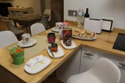 a table with plates of food on top of it at Rosalía de Castro, 41 - Centro - VUT-CO-01904 in Santiago de Compostela