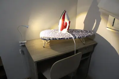 a desk with a cake with a candle on it at Rosalía de Castro, 41 - Centro - VUT-CO-01904 in Santiago de Compostela