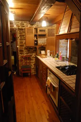 a kitchen with a sink and a stove top oven at Pereje Garden in Pereje